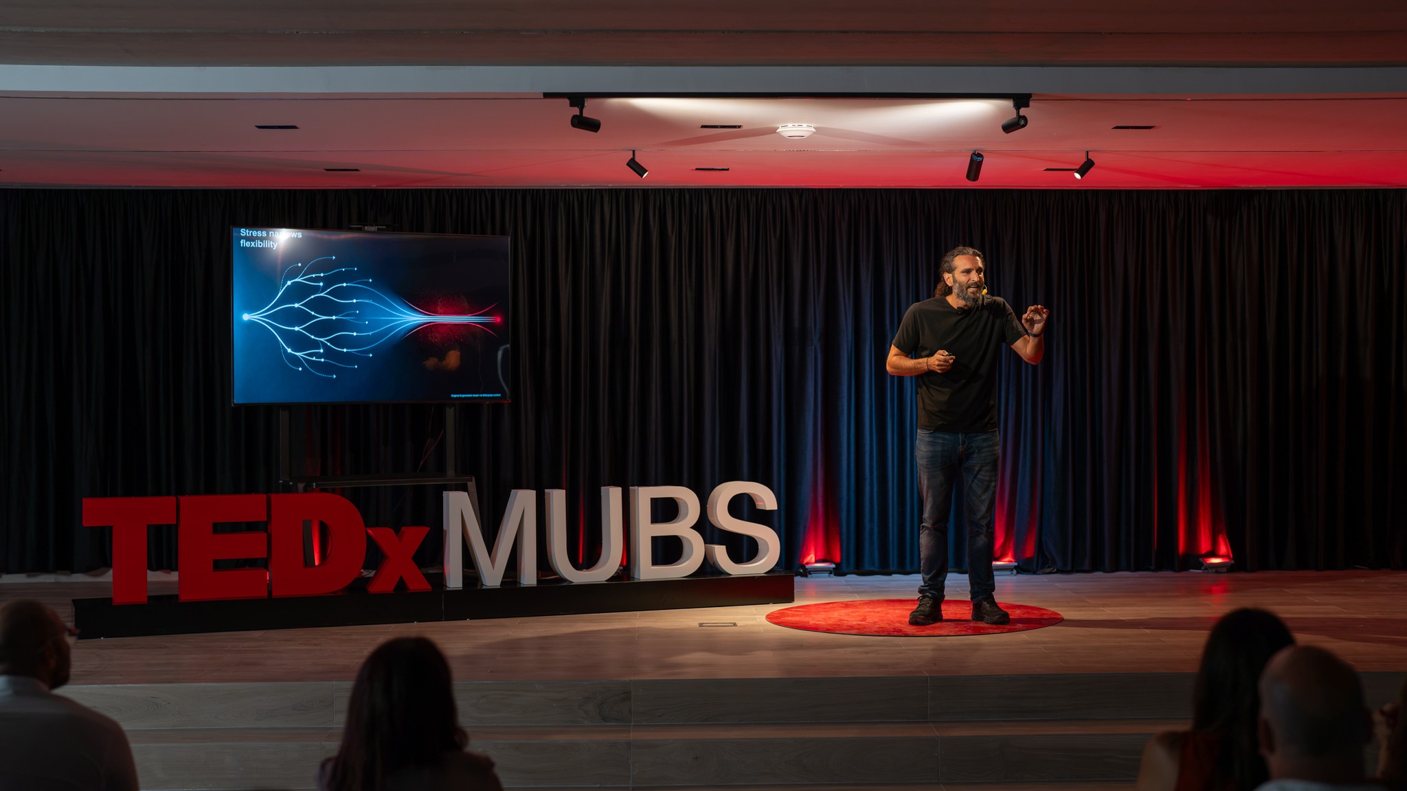 Anthony Hamawi speaking on the TEDxMUBS stage