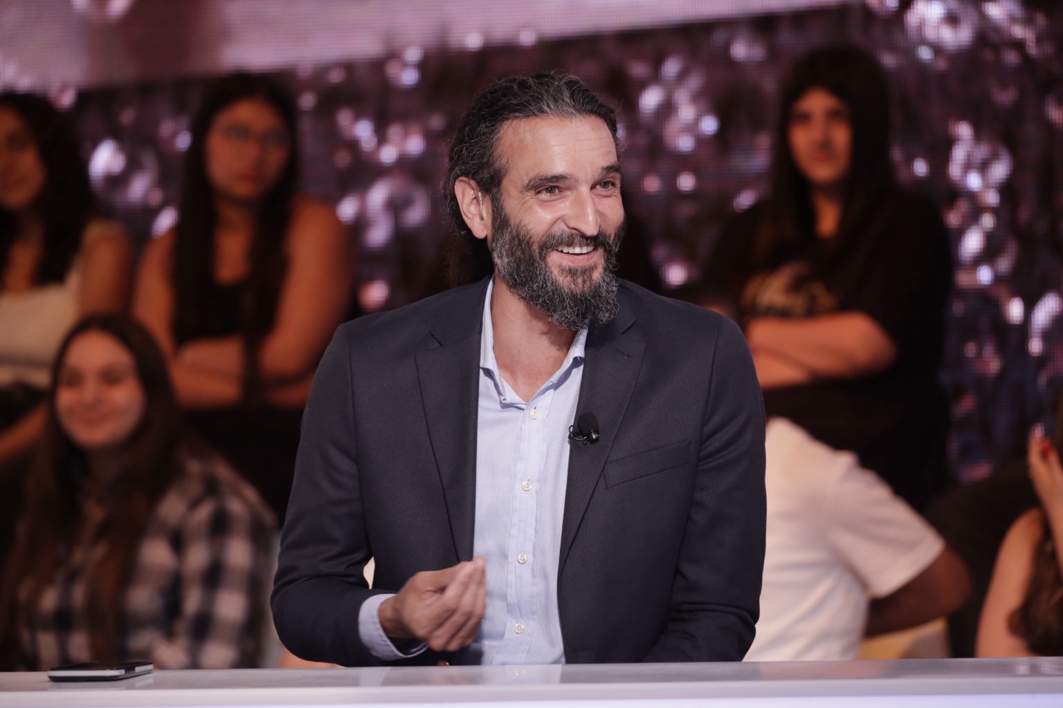 Anthony Hamawi smiling during a television appearance